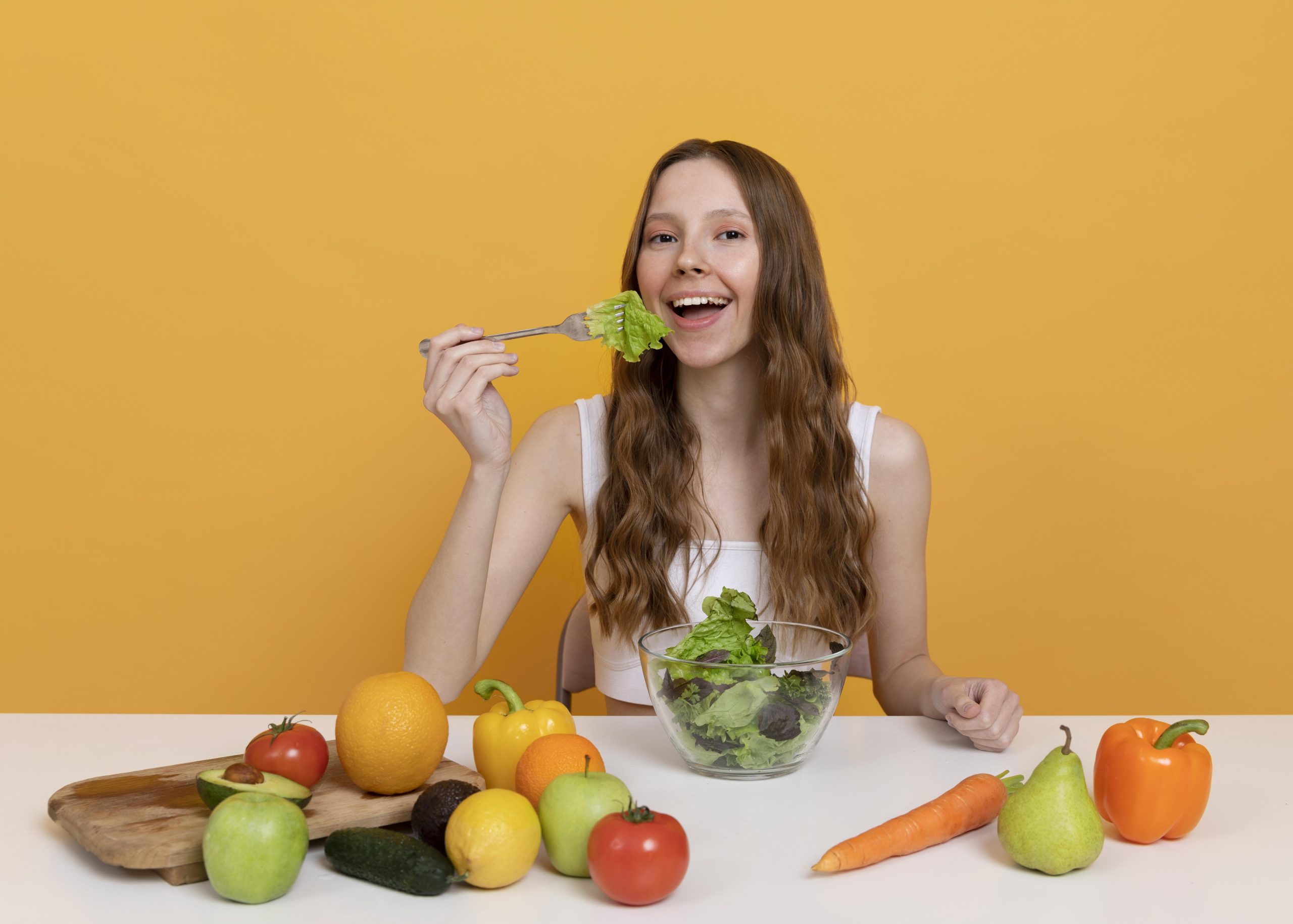 medium shot woman eating lettuce scaled