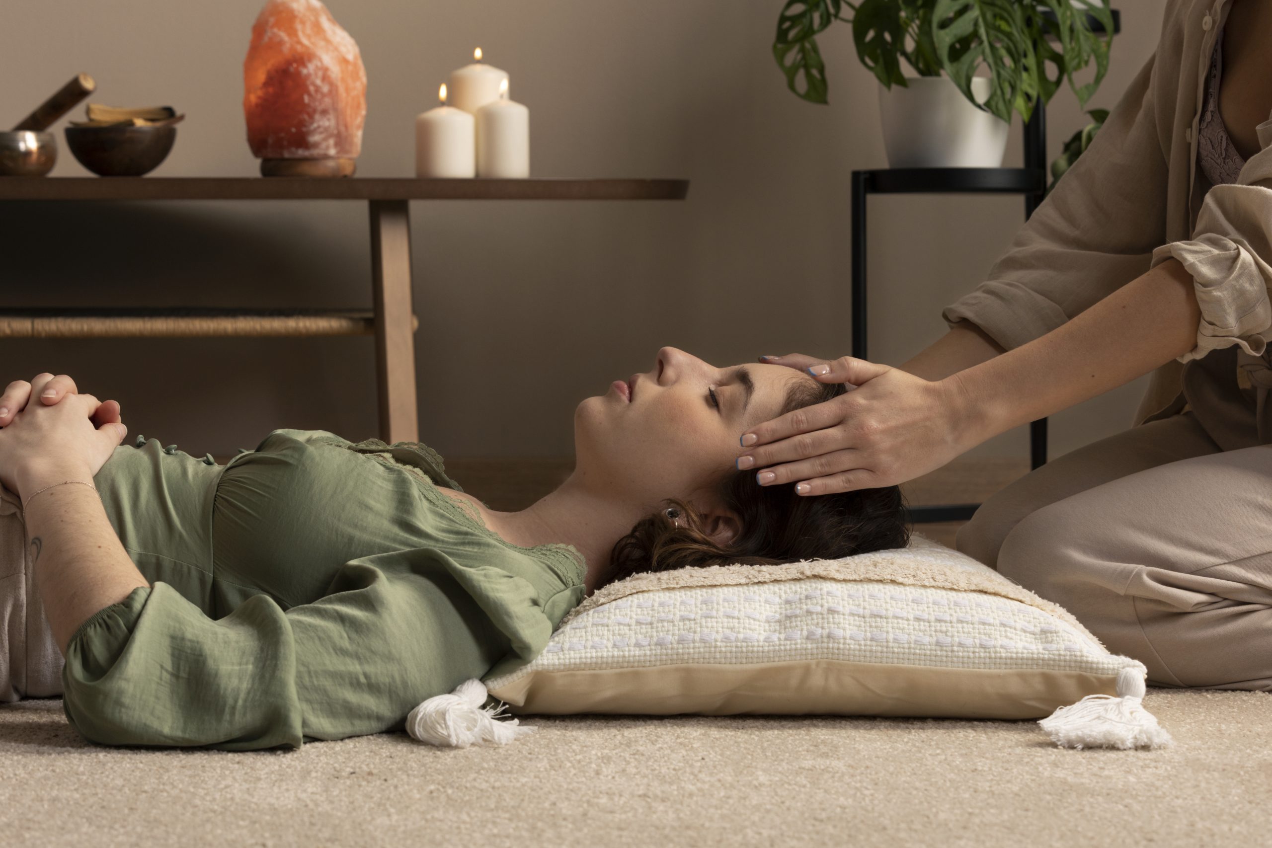 person conducting reiki therapy scaled