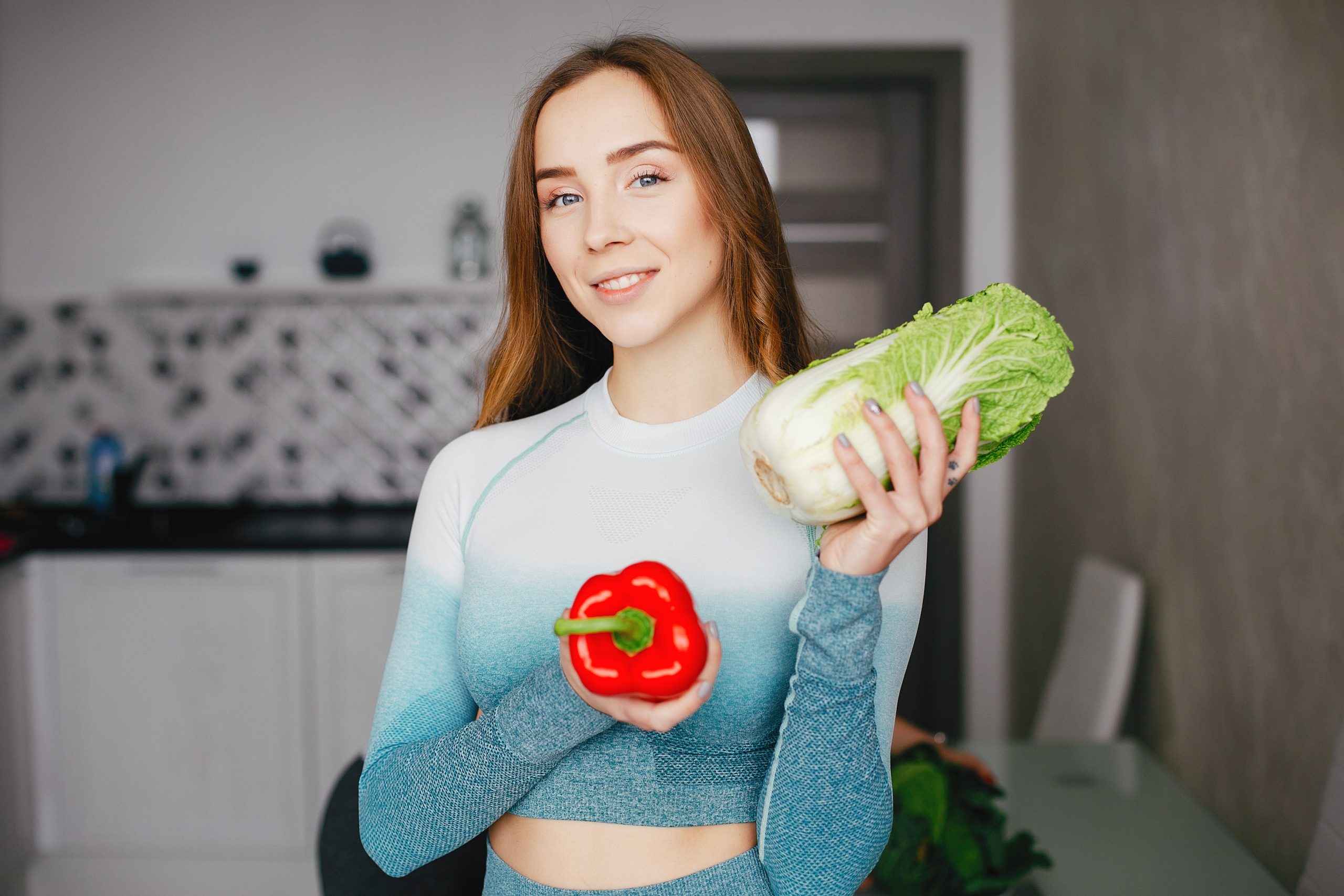 sports girl kitchen with vegetables 1 scaled